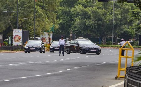 Delhi Traffic Police officials on duty receive AC-equipped helmets and fans to tackle heat