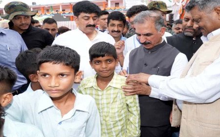CM Sukhu Wins Hearts with Playful Gesture as Schoolchildren Demand Autographs on Their Shirts